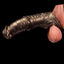 Oieffur Warhorse flexible penis sleeve extender with girth enhancement and cock ring, shown on a silicone model.