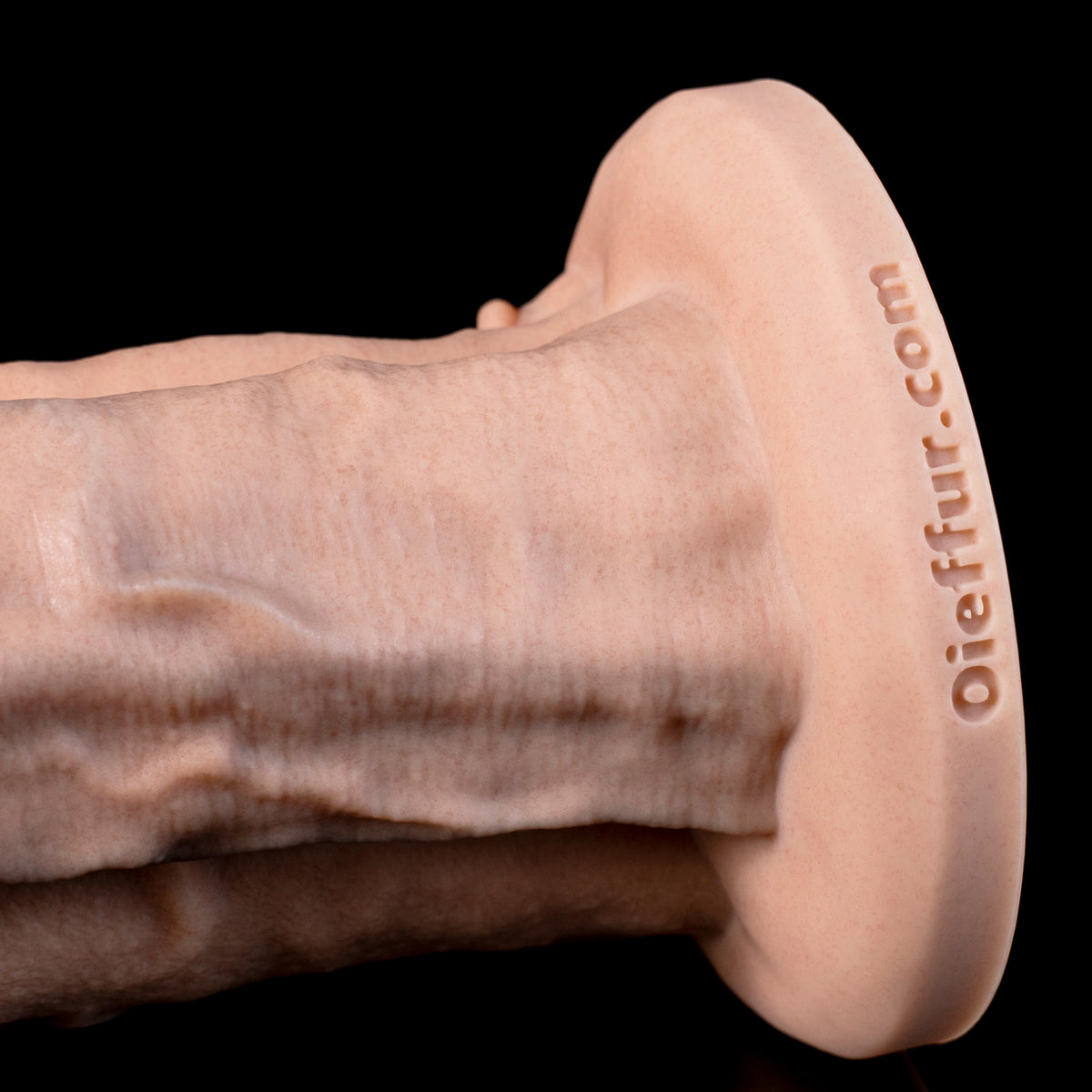 Hermavex multi cock dildo, side view of the root meeting the integrated suction base