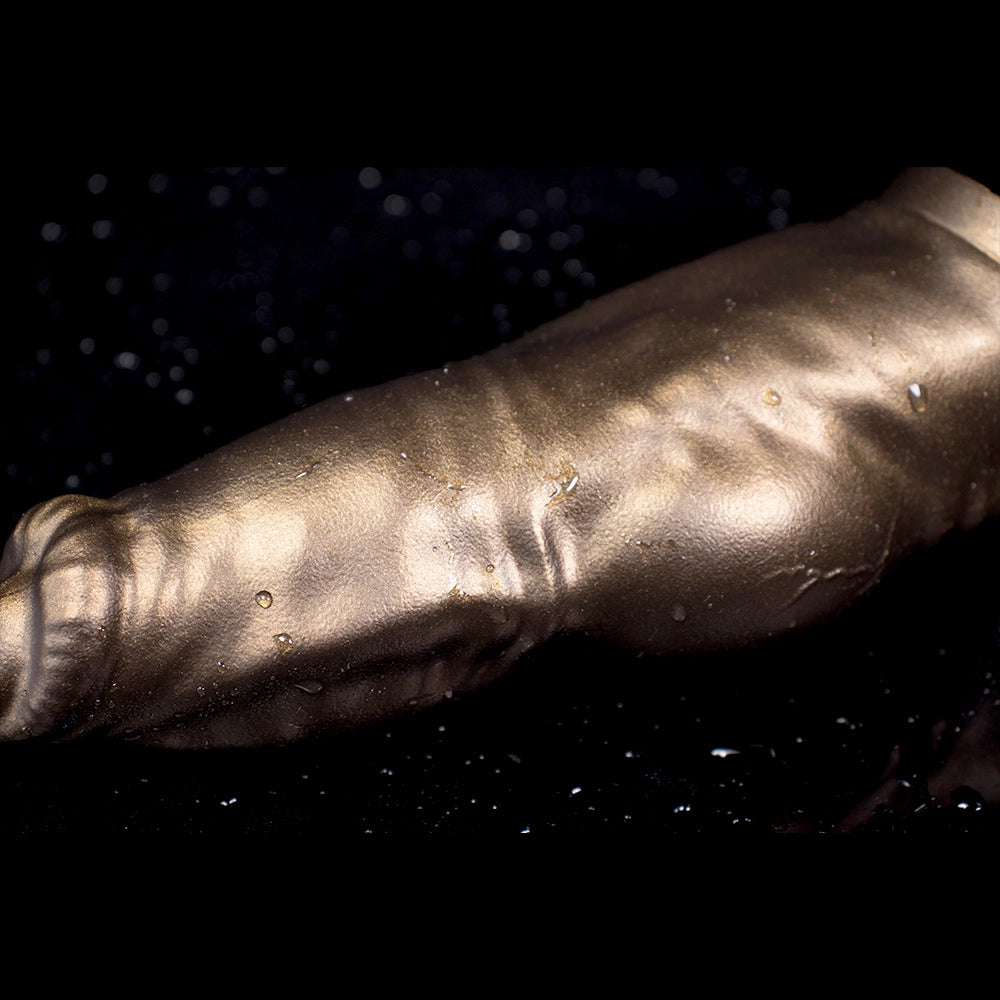 Canine-shaped platinum silicone dog penis sleeve and extender, showing the detailed canine cock design and sculpted surface.