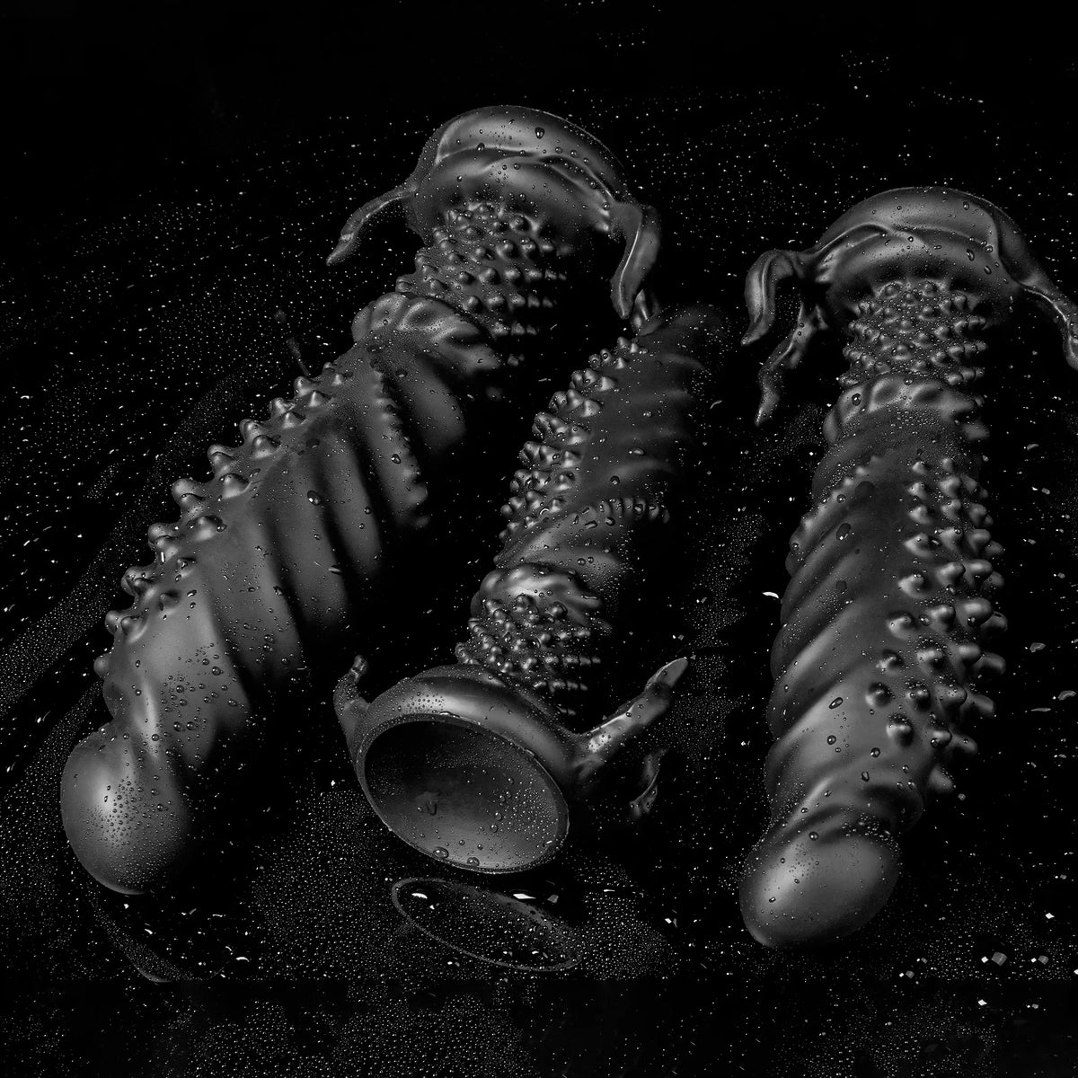 Black Abyss Spiked Dildo by Oieffur, a platinum silicone fantasy dildo with sculpted spikes for enhanced sensation.