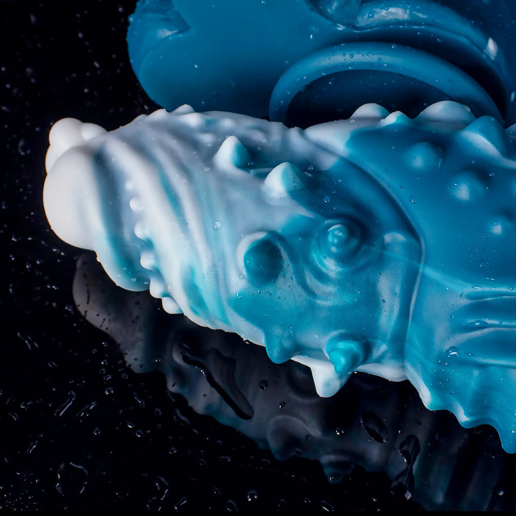 Oieffur Koopa silicone monster dildo with suction cup, displayed in various sizes, showcasing the sculpted surface and flexible design.
